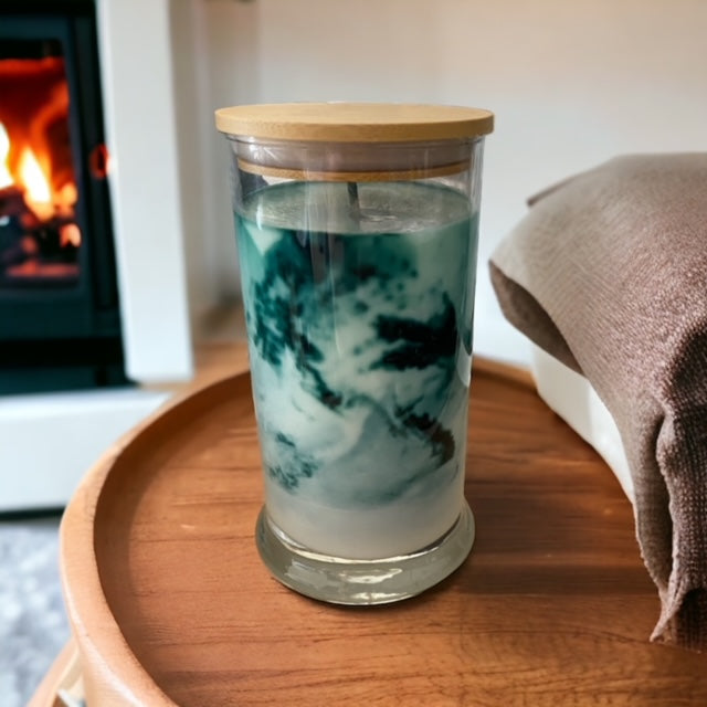 "Lemon Lime Fusion" scented marbled candle by Owl Creek Candles. A luxurious soy wax candle with a stunning marbled design. This candle features vibrant notes of lemongrass, zesty lime, and subtle hints of black currant and sage. Perfect for adding a fresh and uplifting ambiance to your home.
