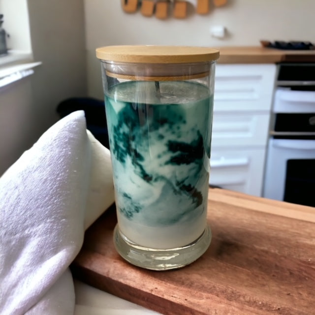 "Lemon Lime Fusion" scented marbled candle by Owl Creek Candles. A luxurious soy wax candle with a stunning marbled design. This candle features vibrant notes of lemongrass, zesty lime, and subtle hints of black currant and sage. Perfect for adding a fresh and uplifting ambiance to your home.